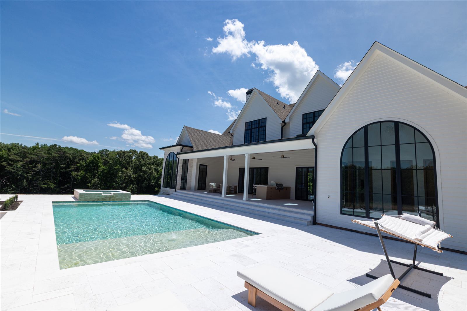 Outdoor pool and covered patio living space